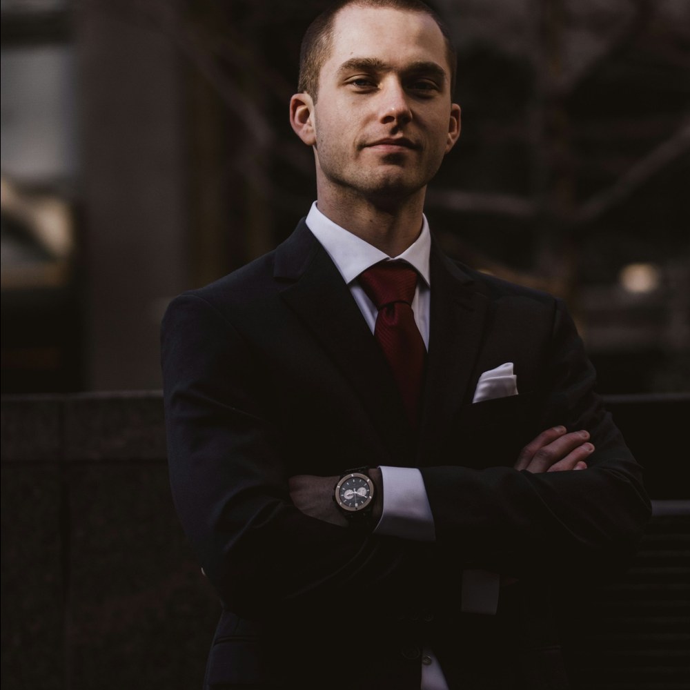 Confident man standing with folded arms for first-message profile guidance
