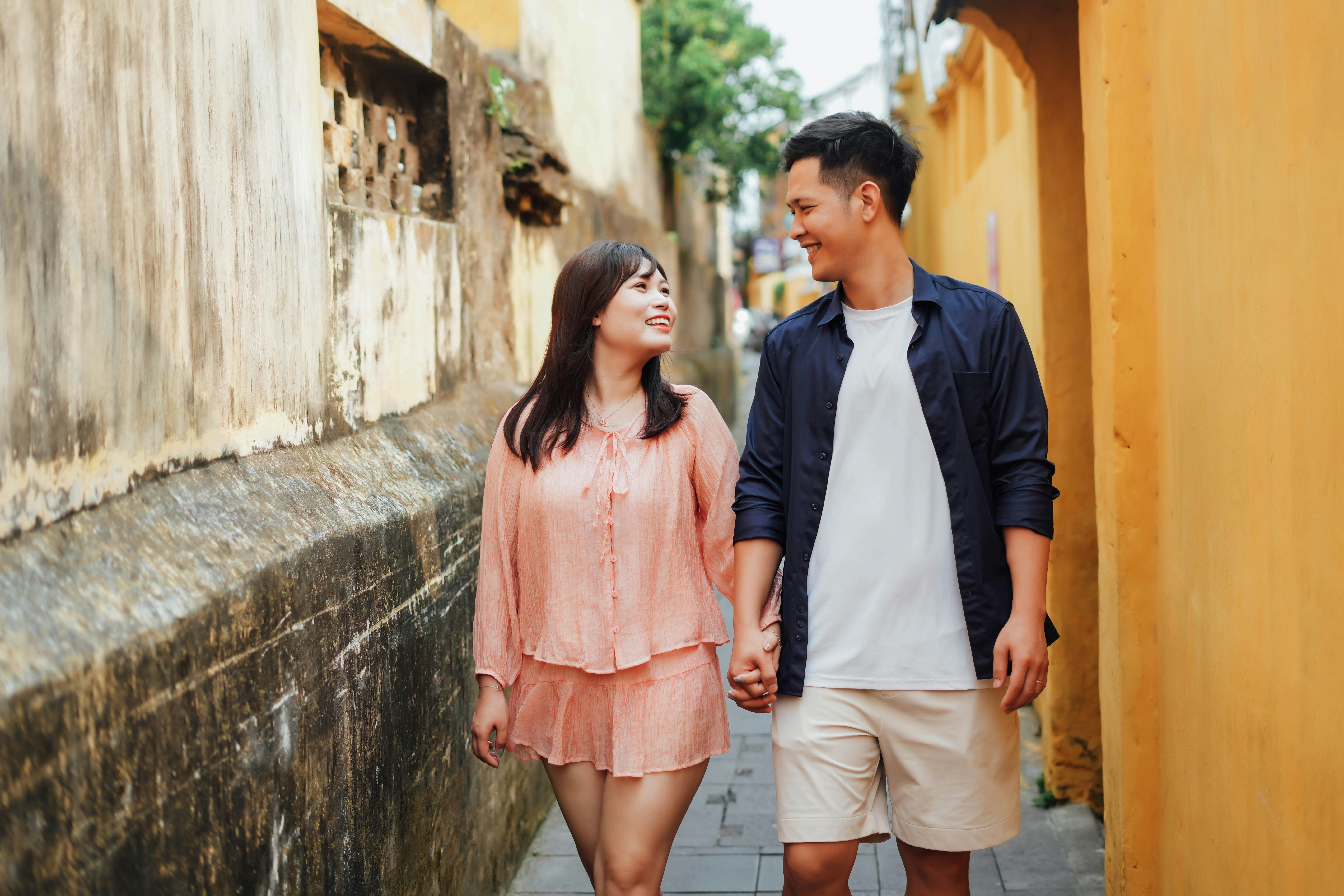 Couple walking through an international city street
